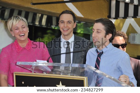 LOS ANGELES, CA - OCTOBER 29, 2014: Kaley Cuoco & co-stars from The Big Bang Theory - Jim Parsons & Simon Helberg - on Hollywood Blvd where she received a star on the Hollywood Walk of Fame.