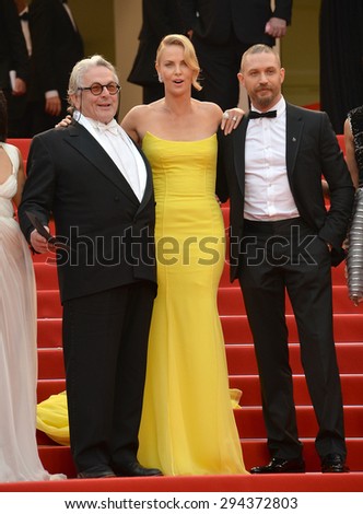 CANNES, FRANCE - MAY 14, 2015: Charlize Theron, Tom Hardy & director George Miller at the gala premiere of their movie \
