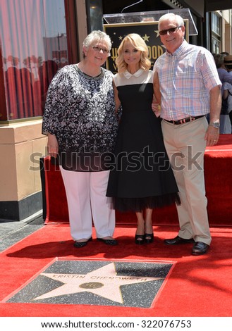 LOS ANGELES, CA - JULY 24, 2015: Kristin Chenoweth & parents on Hollywood Blvd where Chenoweth was honored with the 2,555th star on the Hollywood Walk of Fame.