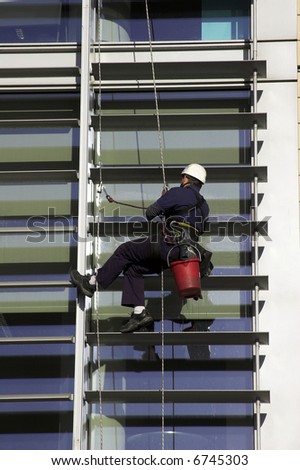 Workman Abseiling A Corporate Building