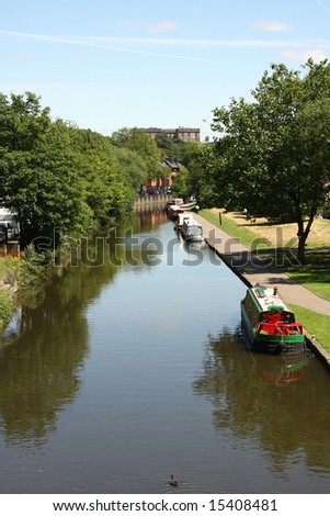 Narrowboats On A Nottingham Canal With Nottingham Castle In The Distance