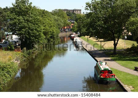 Narrowboats On A Nottingham Canal With Nottingham Castle In The Distance