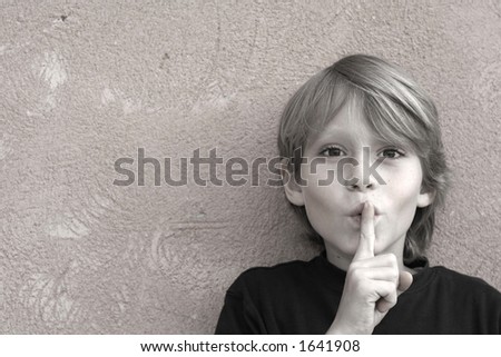 Little boy asking for silence