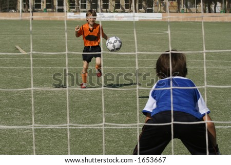 footballer shooting at goal