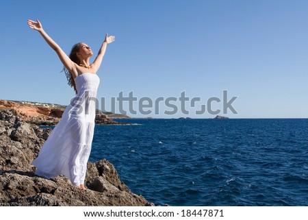 happy woman praising the skies