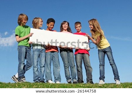 group of diverse kids holding blank sign
