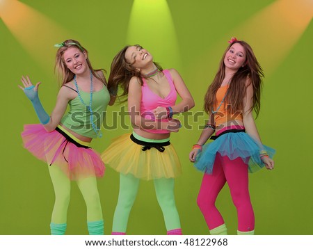 stock photo teen party dancers SHOT ON GREEN TEXTURED WALL 