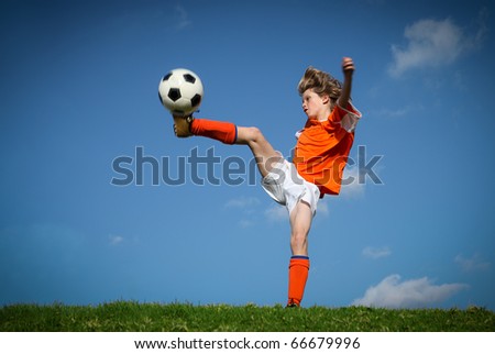 kid playing soccer kicking football kid playing soccer kicking football
