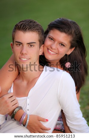 smiling young couple with white perfect straight teeth