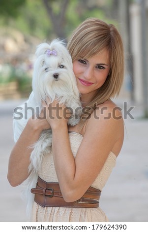 young woman with pet Maltese dog