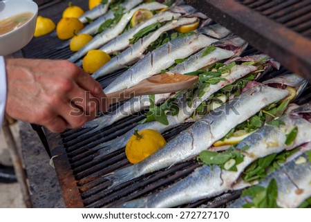 cooking fish for dinner on grill