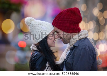 christmas couple in city lights