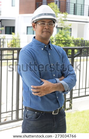 Portrait of  Asian male contractor engineer with hard hat