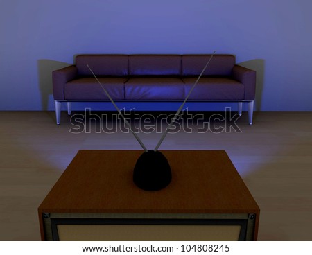 Sofa in front of a television.