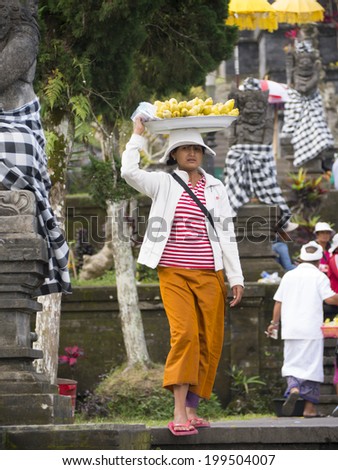BALI - MAY 2014 : Locals merchant in Besakih Temple, Bali, Indonesia on May 15, 2014. Besakih Temple is the most important, the largest and holiest temple of Hindu religion in Bali.