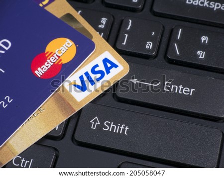 BANGKOK - JUL 14, 2014 : Photo of VISA and Mastercard credit card. VISA and Mastercard is an American multinational financial services corporation