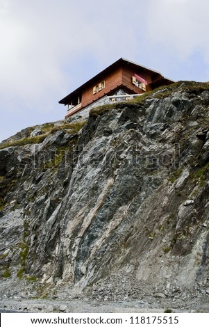 Wooden house isolated on mountain top/mountain chalet/