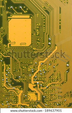 photo of circuit board in gold and black.