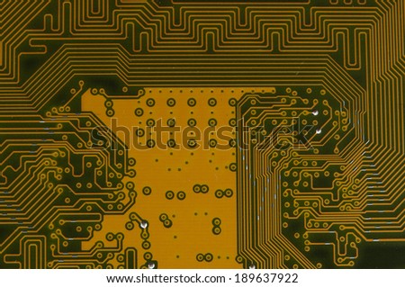 photo of circuit board in gold and black.