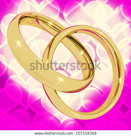 Gold Rings On Pink Heart Bokeh Background Represents Love Valentine And Romance