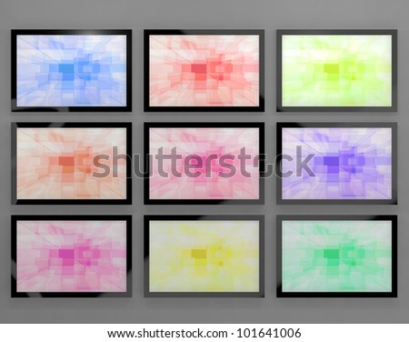 TV Monitors Wall Mounted In Different Colors Representing High Definition Televisions Or HDTV