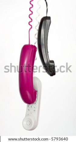 handset phones hanging over a white background