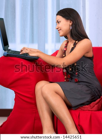 young working girl sitting on a couch