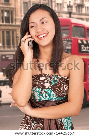 girl on phone in a city street
