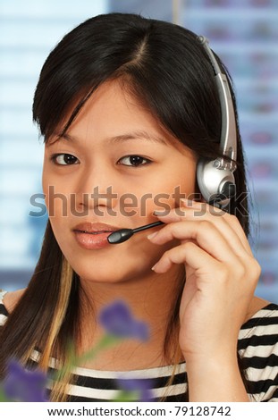 Hotline assistant talking to a customer on the phone