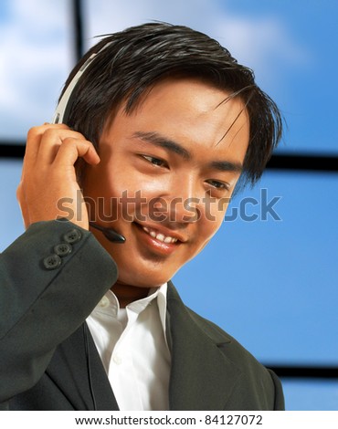 Male Telemarketing Representative Talking To A Customer And Wearing A Headset