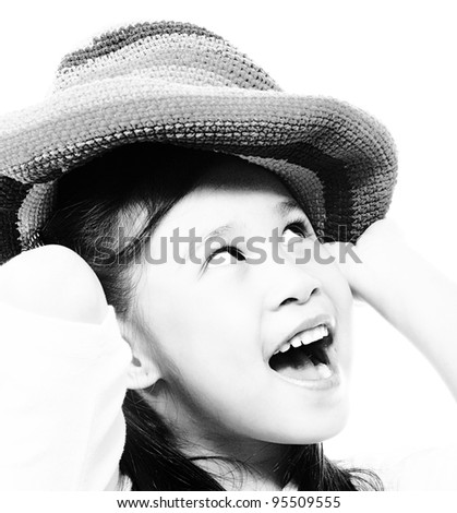 Smiling And Happy Girl Putting On A Floppy Hat