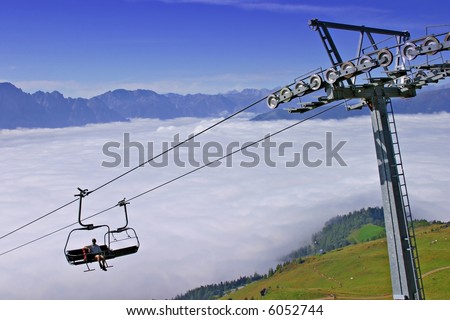 chairlift above the cloud ceiling