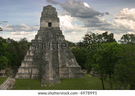 The Jaguar temple and empty central plaza at Tikal, early evening. Guatemala, Central America