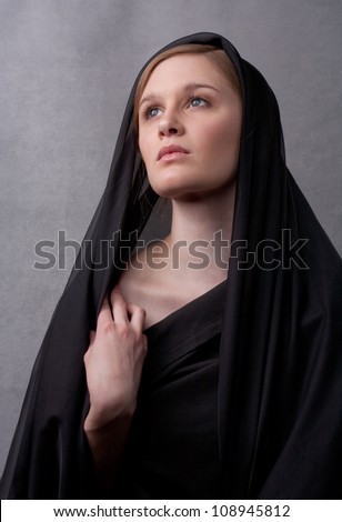 Beautiful Young Woman in Black With Head Covered