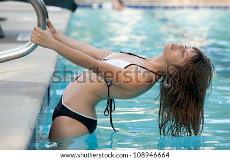 Woman Arching Back in Pool