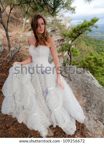 Beautiful Woman in Fancy Dress on Mountain