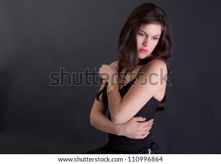 Woman in Dress Hugging Self