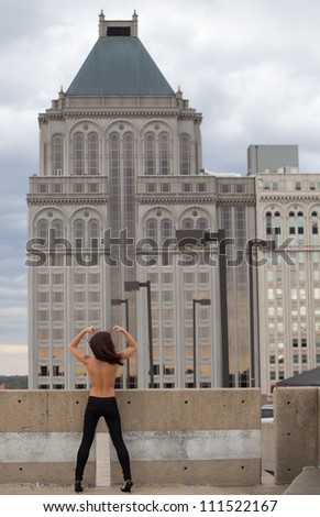 Topless Woman From Behind Lifting Arms Triumphantly