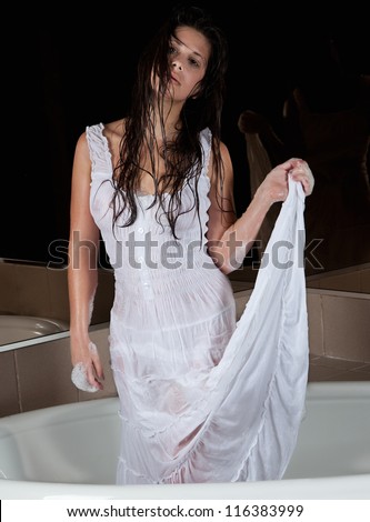 Sexy Woman in Sheer, Clingy Wet Dress