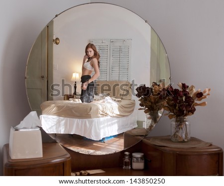 Reflection of Beautiful Woman in Mirror
