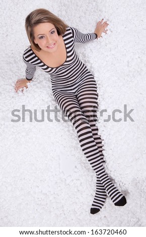 Teen in Zebra Stripe Bodysuit on White Packing Peanuts