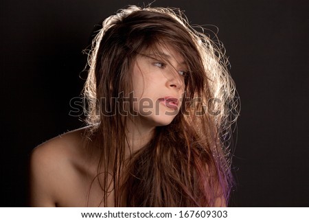 Pretty Young Woman With Messy Hair Against Black Background