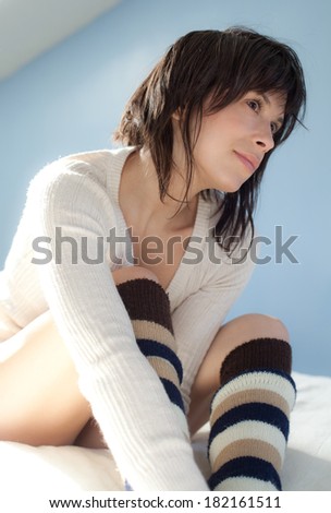 Cute Young Woman in Knee Socks and Sweater