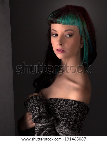 Seductive Young Woman in Off Shoulder Sweater