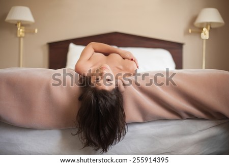 Woman Lying on Back in Bed