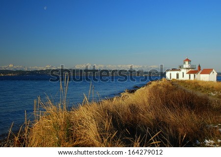 Clear winter day at Seattle\'s Discovery Park lighthouse.