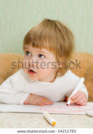 Small cute painting girl at home