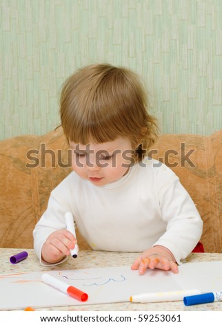 Small cute painting girl at home