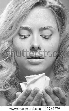 Young beautiful woman with snowy skin (black and white)