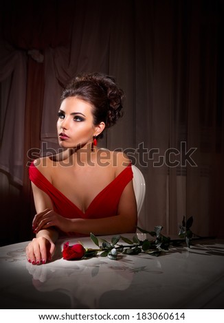 Fashion portrait of young woman with rose flower (normal version)